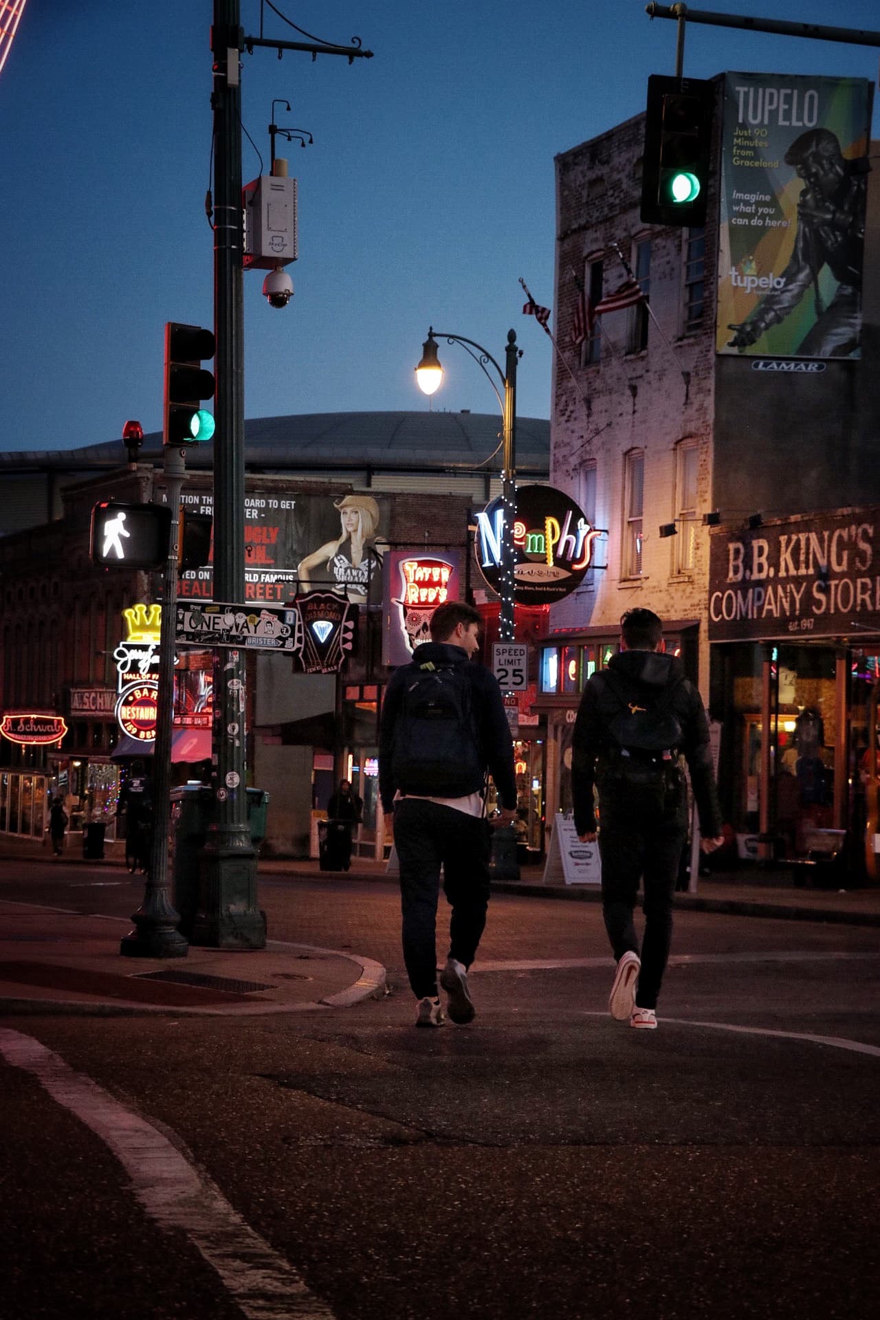 Two tourists walking around Beale Street