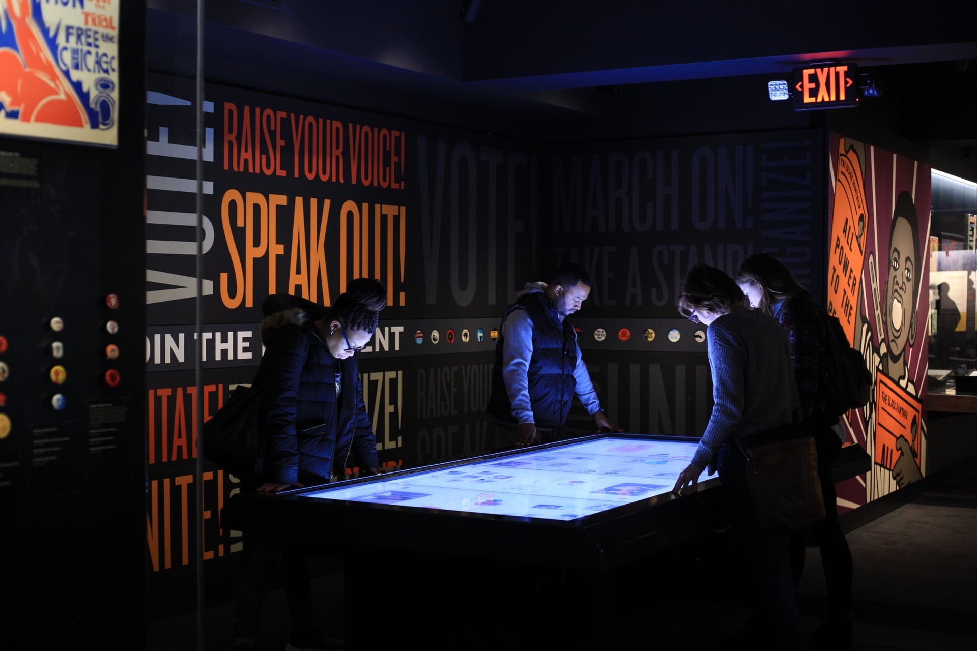 People gathering around an exhibit at the National Civil Rights Museum